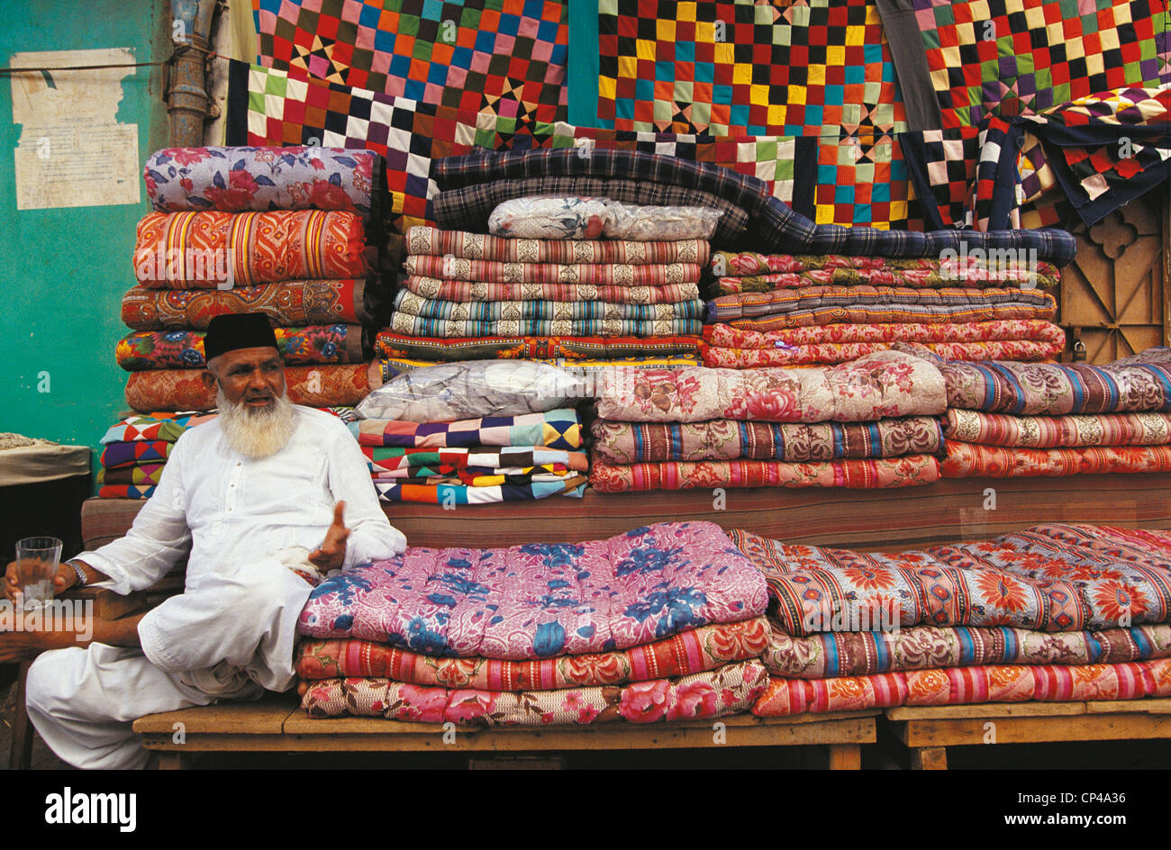 Pakistan Sindh Karachi. Carpet seller in the bazaar Stock Photo Alamy