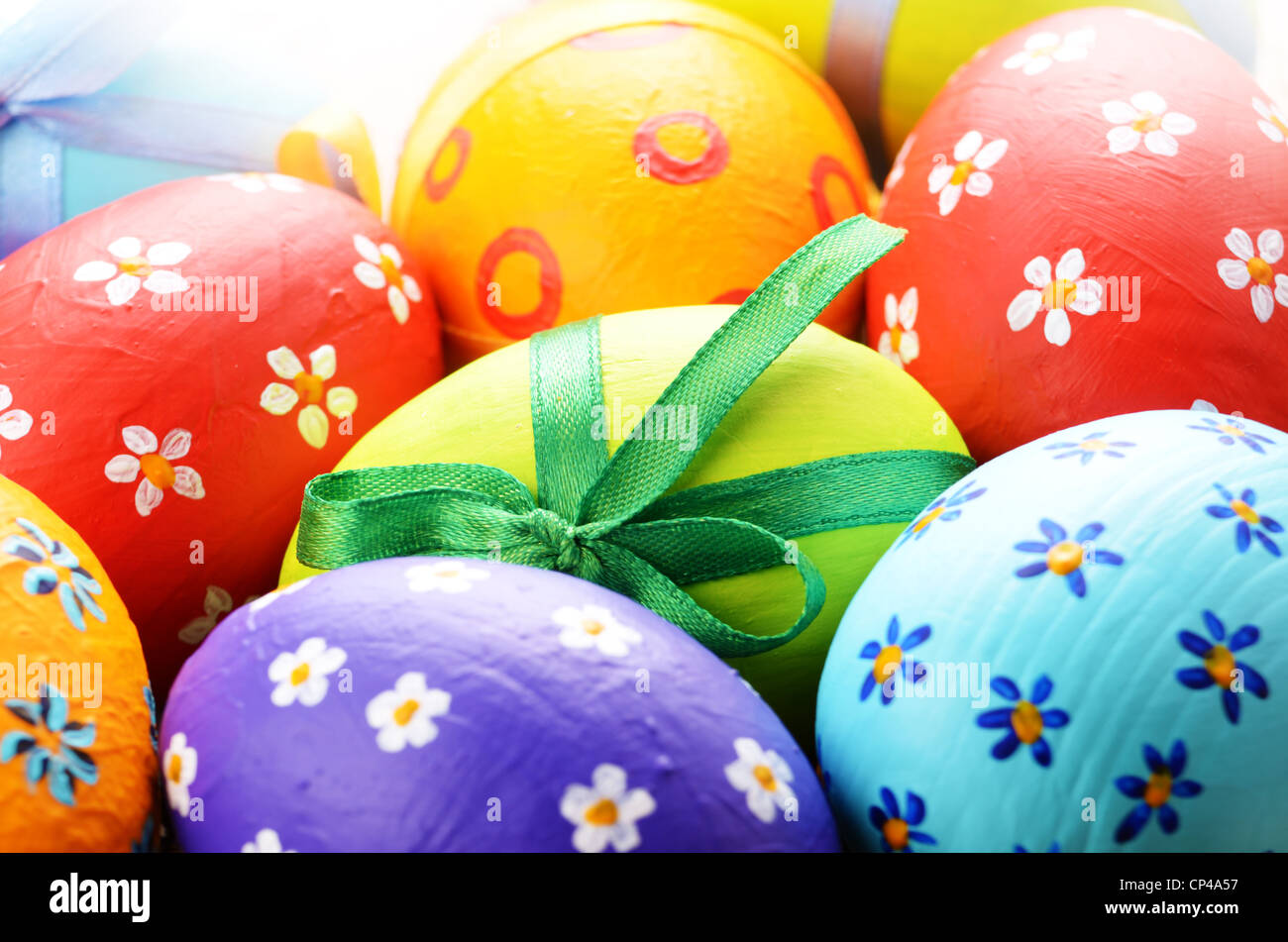 Painted easter eggs with bows background Stock Photo