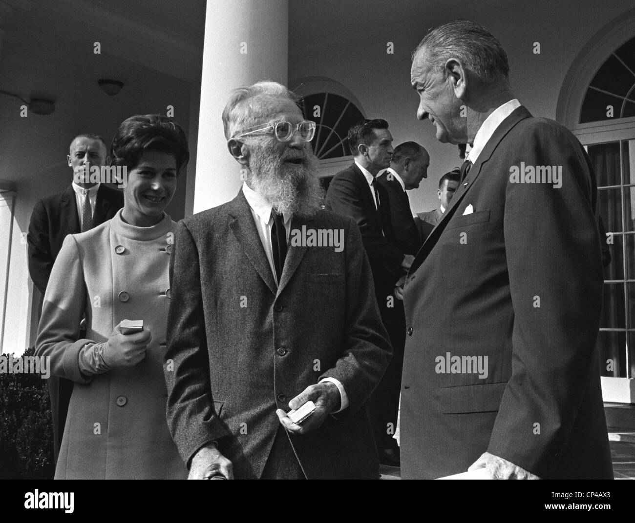 LBJ's Great Society programs. President Lyndon Johnson talks with master photographer Edward Steichen and his young wife after Stock Photo