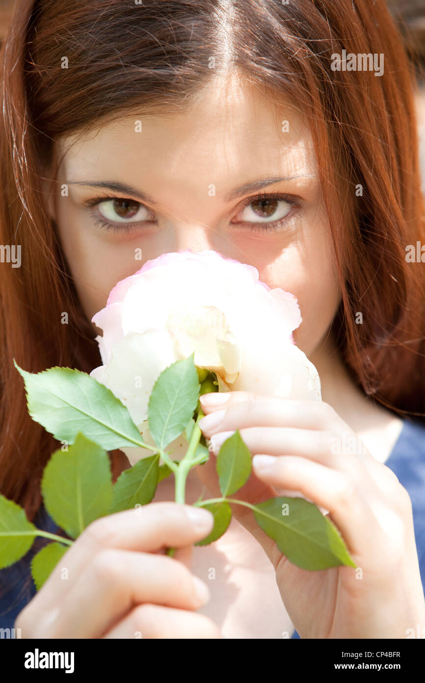 woman smelling a rose Stock Photo Alamy