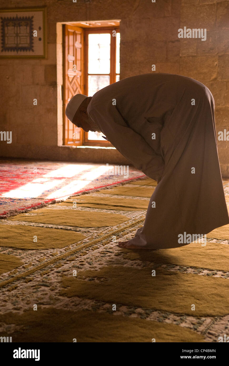 Muslim at prayer in Fakhreddine's mosque in the Ottoman era town of Deir al-Qamar, Chouf Mountains, Lebanon. Stock Photo