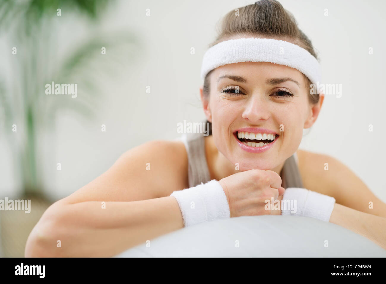 Portrait of happy healthy woman on fitness ball Stock Photo - Alamy