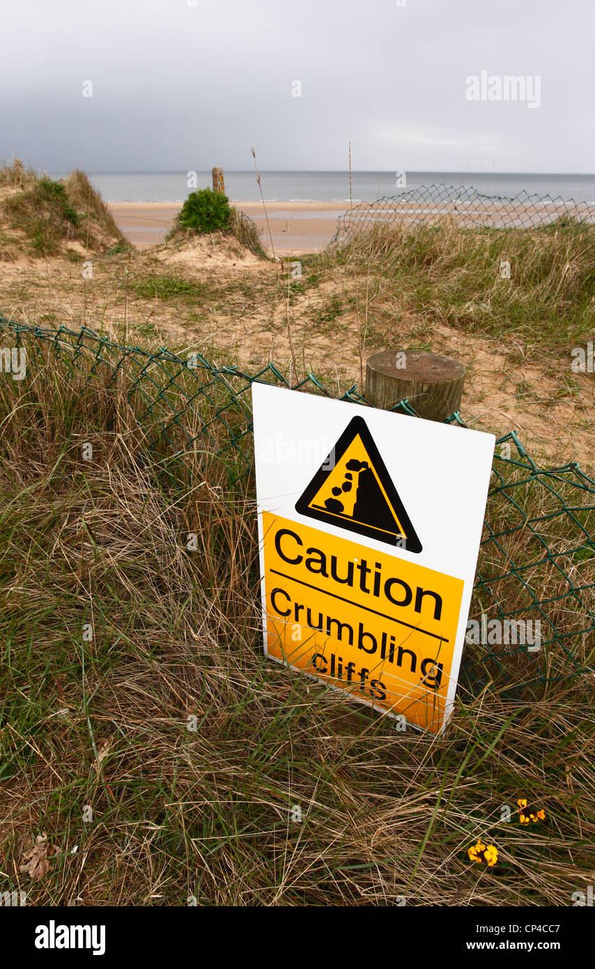 Warning sign for crumbling cliffs at Hunstanton on the Norfolk coast. Stock Photo