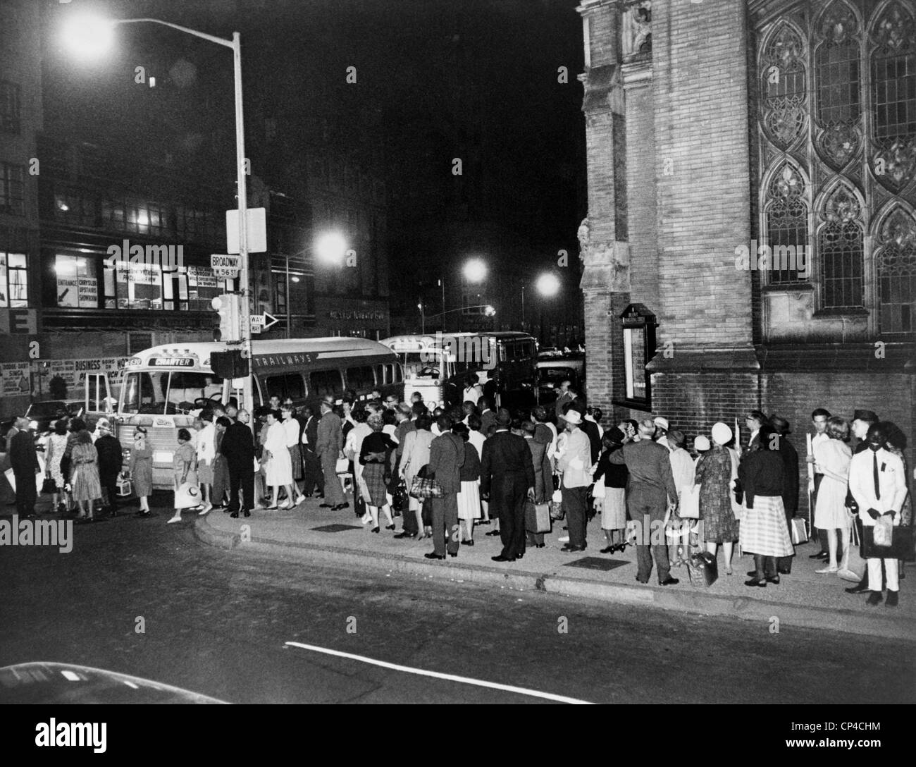 1963 March on Washington. In the early morning, Marchers boarding buses for Washington, D.C. outside Broadway Congregational Stock Photo