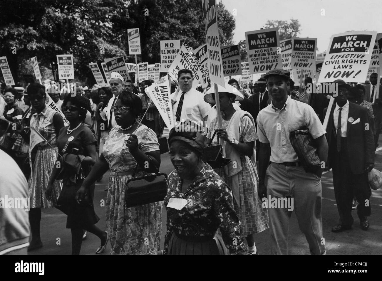 1963 March on Washington. Marchers carrying signs in the streets of Washington, D.C. Signs addressed civil rights, segregation, Stock Photo