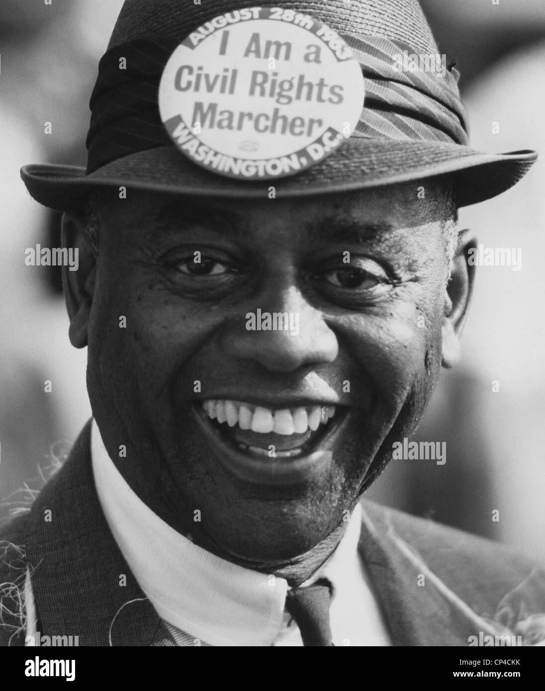 1963 March on Washington. Smiling marcher wearing a hat with a button that reads: 'I am a Civil Rights Marcher.' Aug. 28, 1963. Stock Photo
