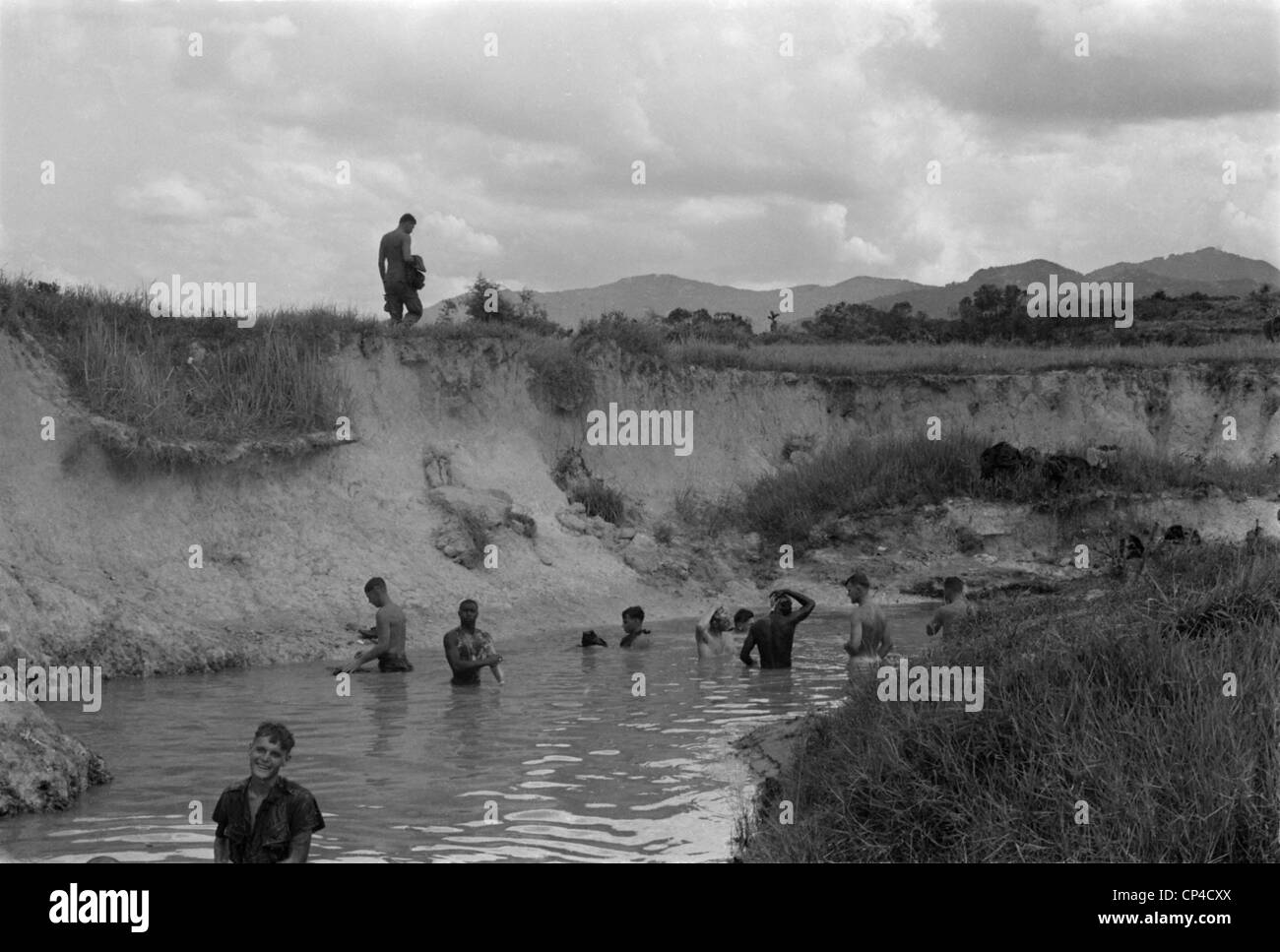 Vietnam War. US Marines bathe in the stream at the base of Hill 51. Hill 51 was the site of a combat base intended to secure Stock Photo