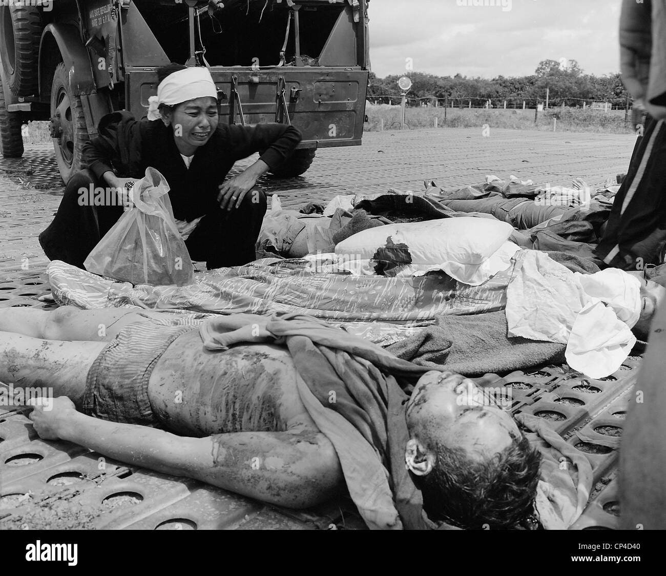 Vietnam War. South Vietnamese soldier's widow weeps over the body of her husband, one of the South Vietnamese Army casualties Stock Photo