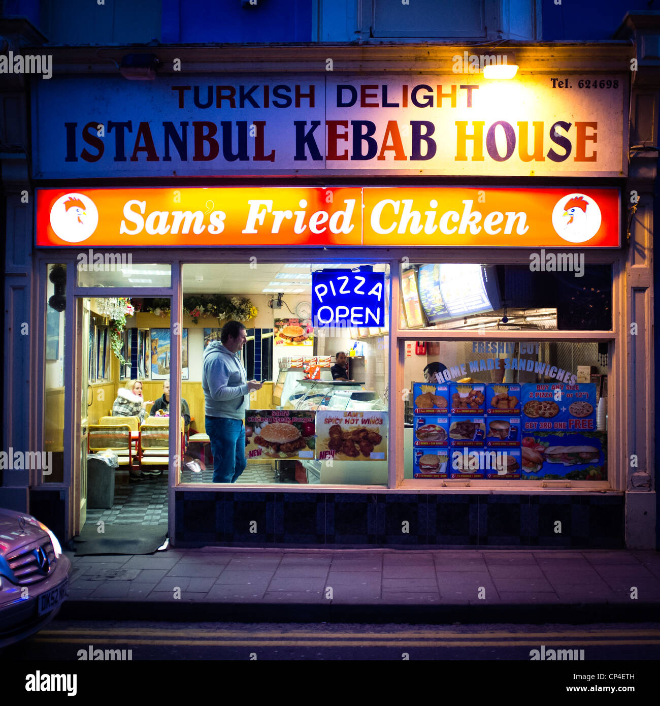 Exterior, 'Sam's Fried Chicken' , turkish kebab shop, night, UK Stock Photo