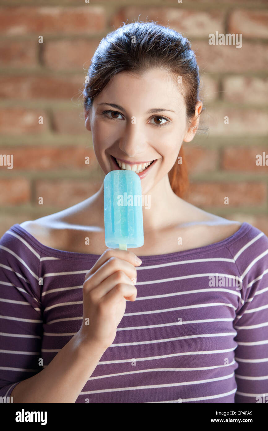 woman eating a popsicle Stock Photo - Alamy