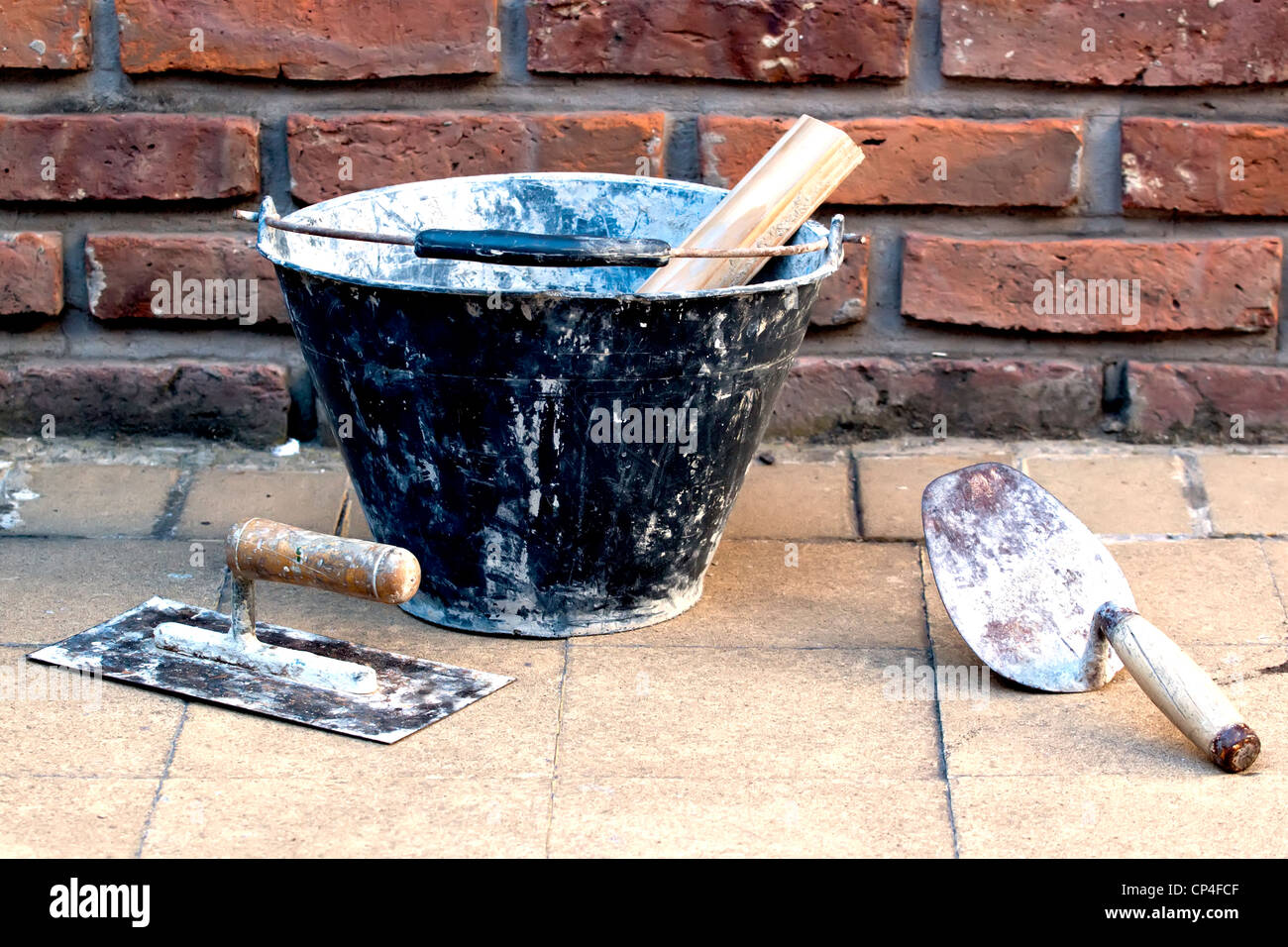 masonry tools near a brick wall Stock Photo Alamy