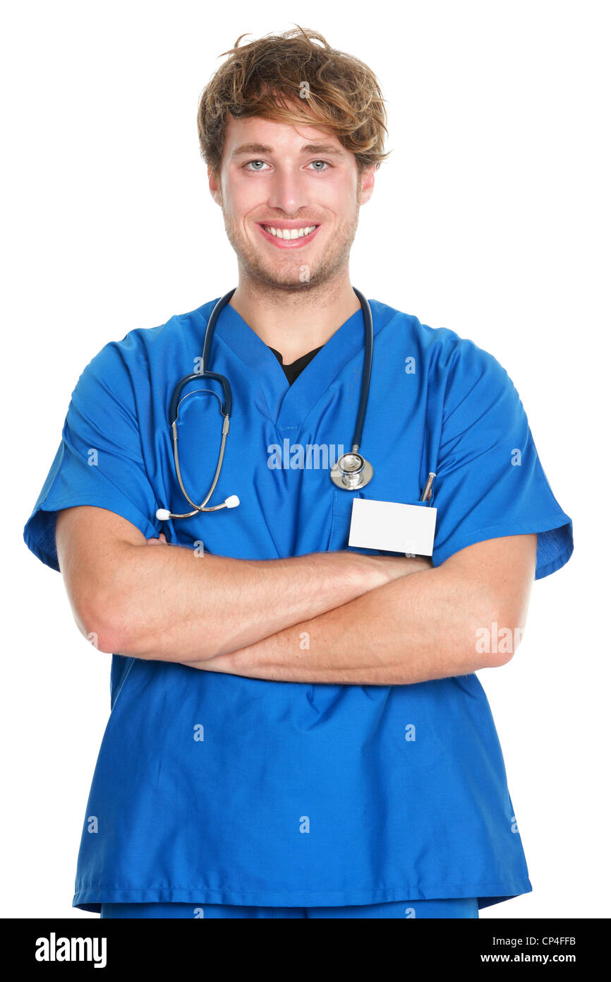 Portrait of happy confident male nurse with arms crossed in scrubs standing isolated on white background Stock Photo