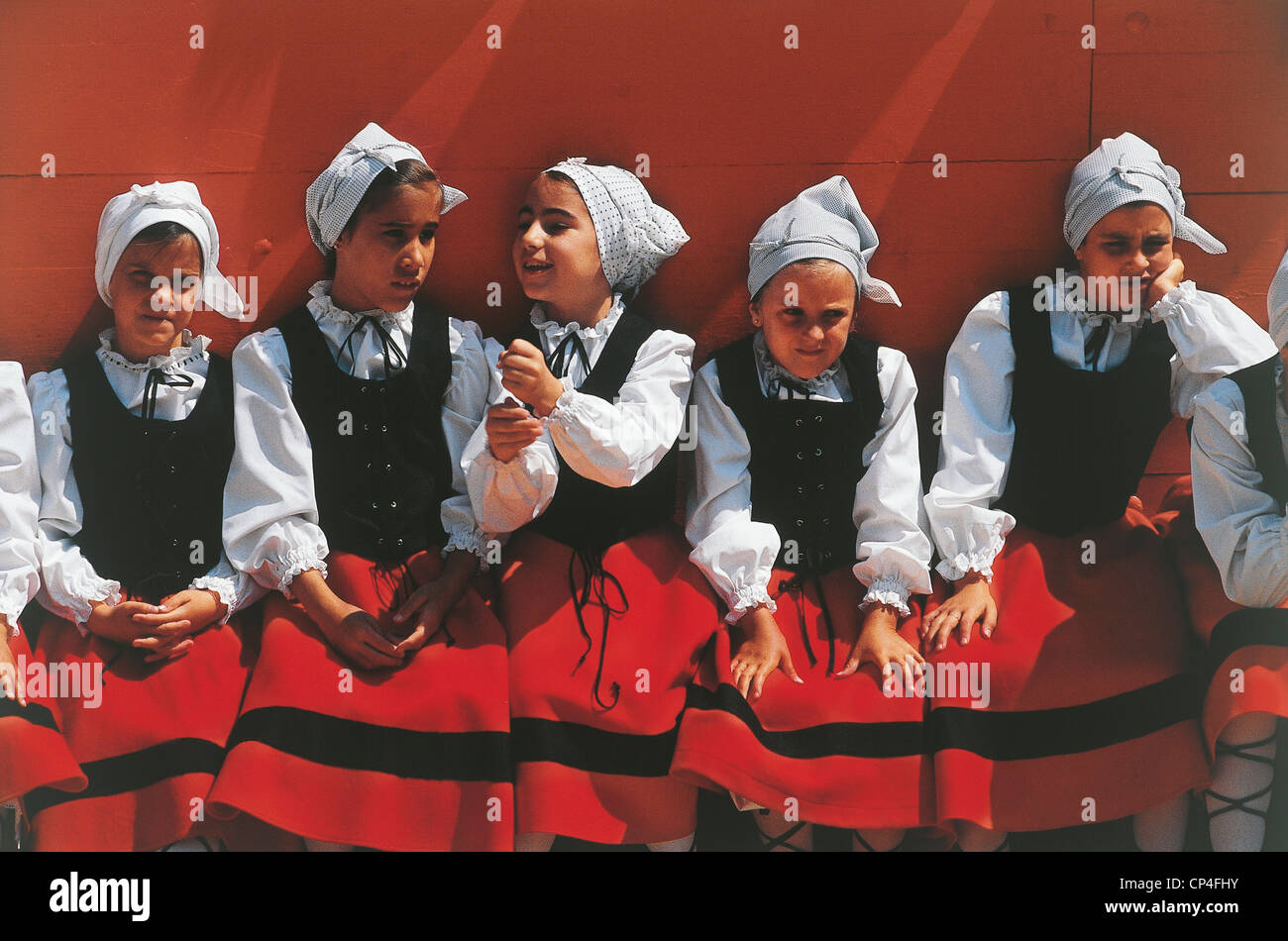 Spain - Navarra - Pamplona, San Fermin Festival. Girls in costume beret ...