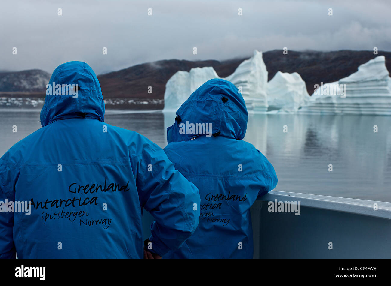 Greenland West Coast Qaasuitsup Kommunia Upernavik. Two passengers of polar cruise ship M/S Fram watching Egip Sermia Glacier. Stock Photo