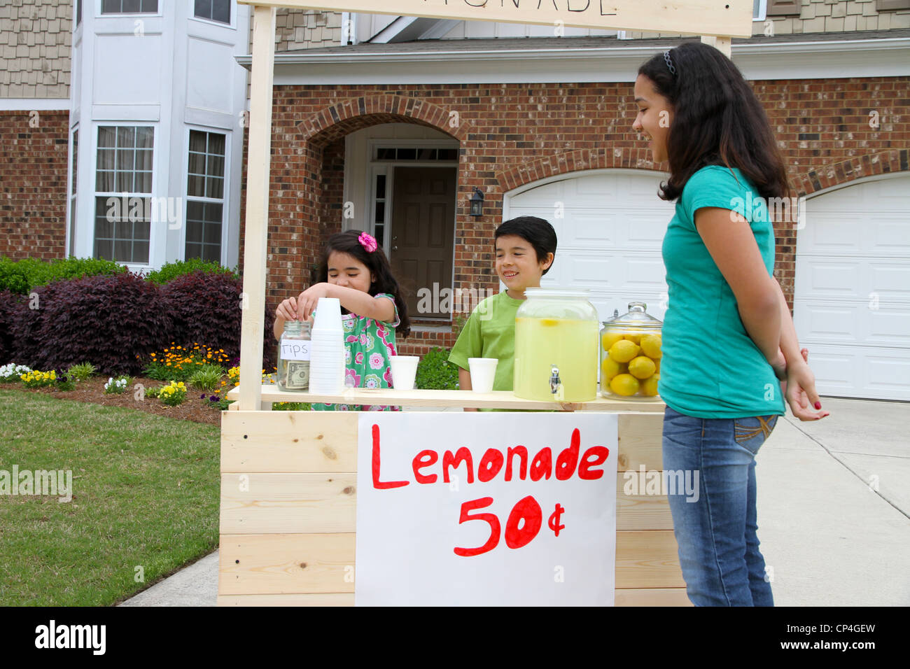 Children selling lemonade in front of their home Stock Photo Alamy