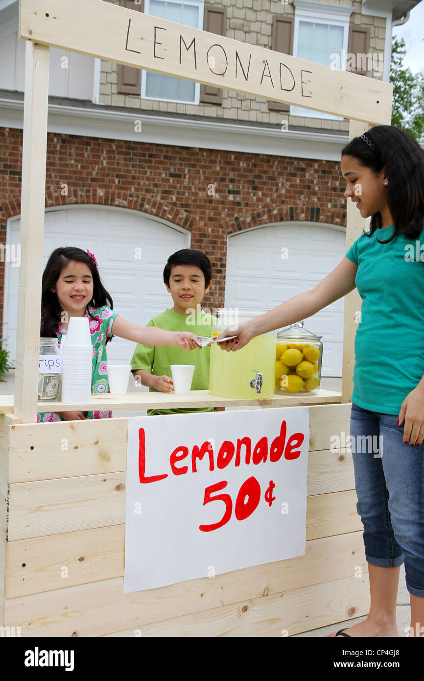 Children selling lemonade in front of their home Stock Photo Alamy