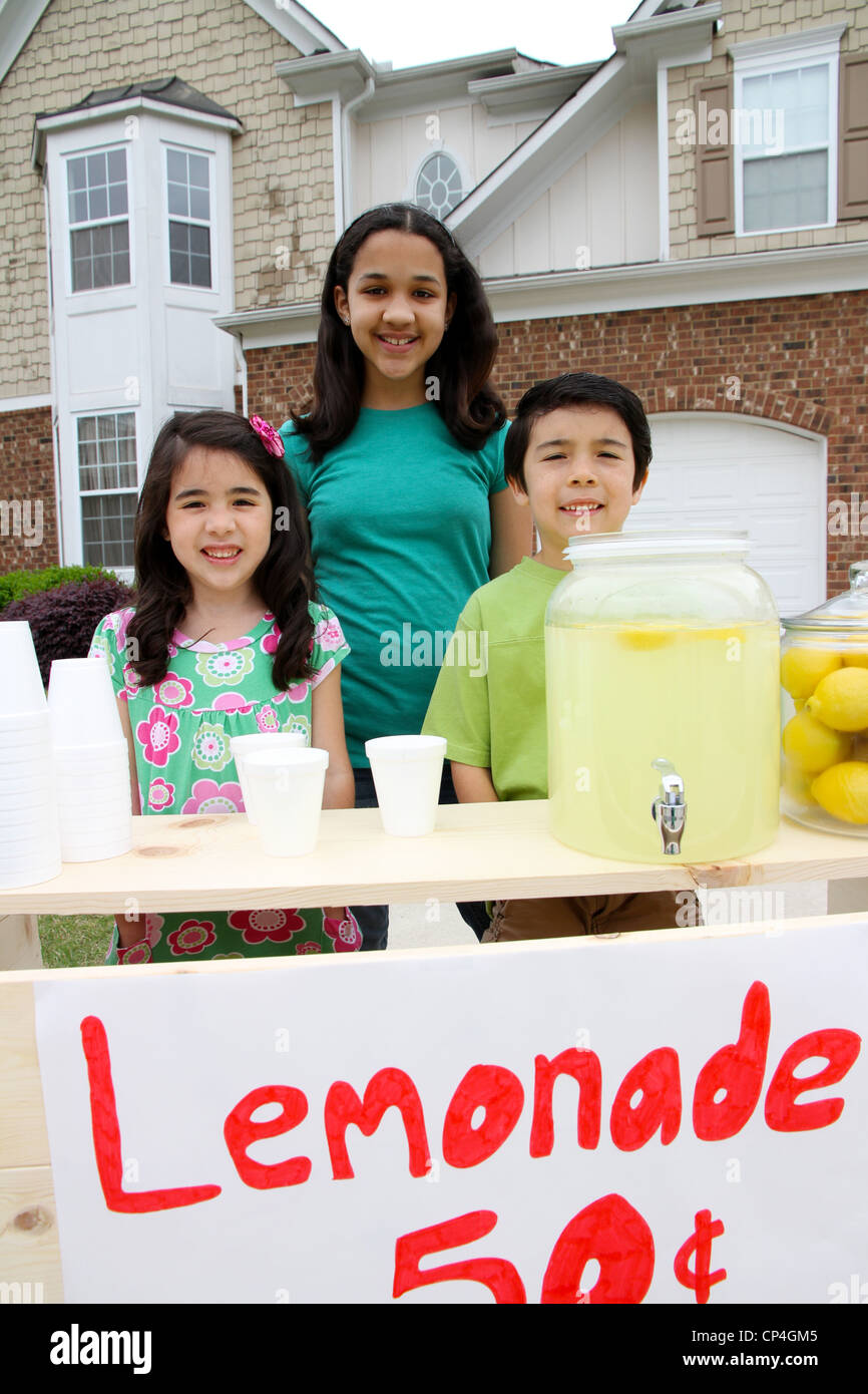 Children selling lemonade in front of their home Stock Photo Alamy