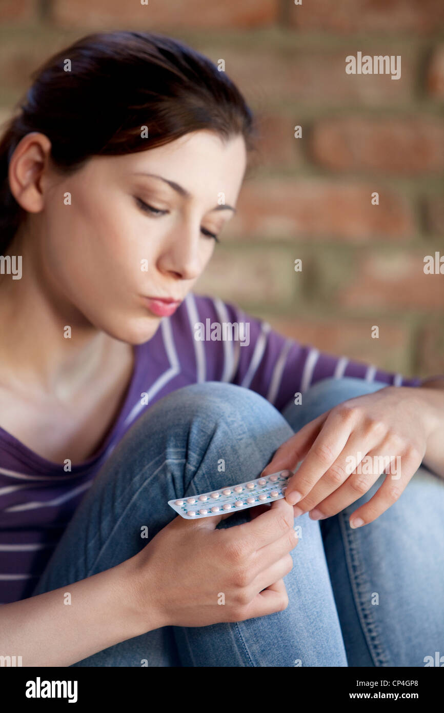 women,birth control pills blister Stock Photo