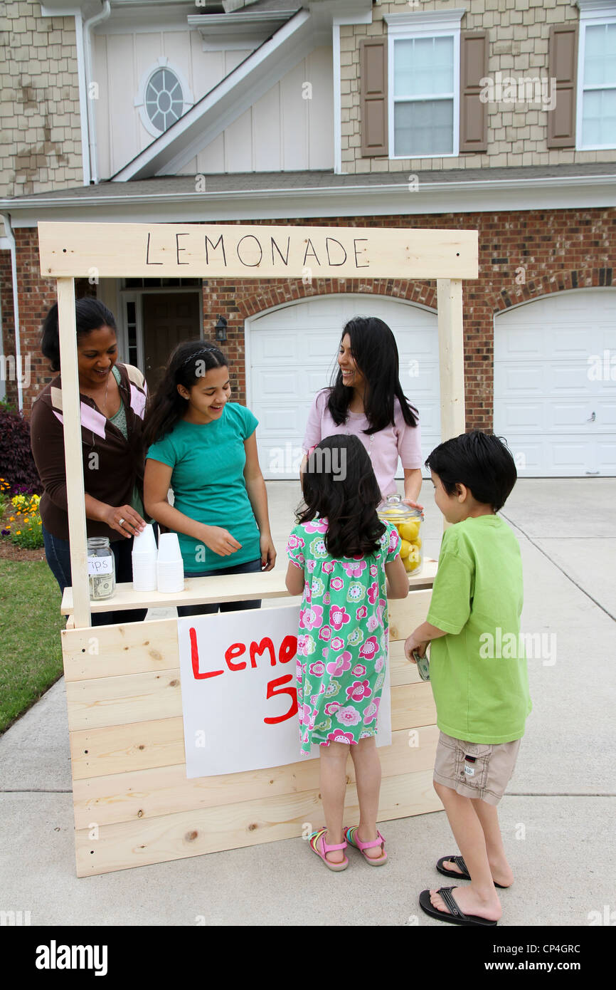 Children selling lemonade in front of their home Stock Photo Alamy