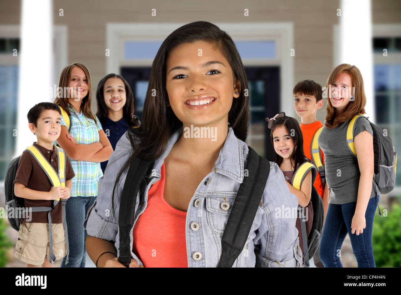 Group of children standing in front of their school Stock Photo - Alamy