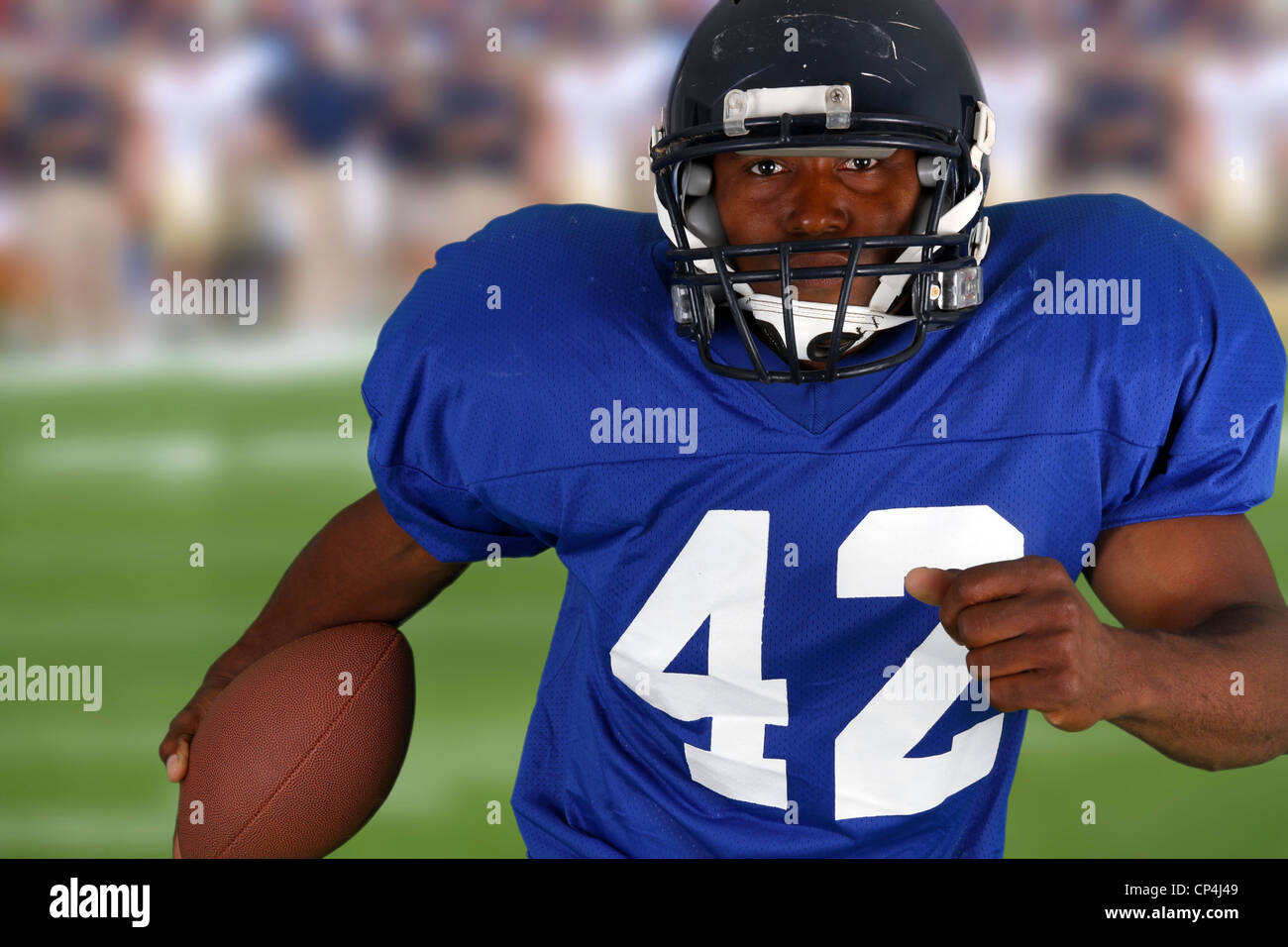 Football player playing in a game on field Stock Photo