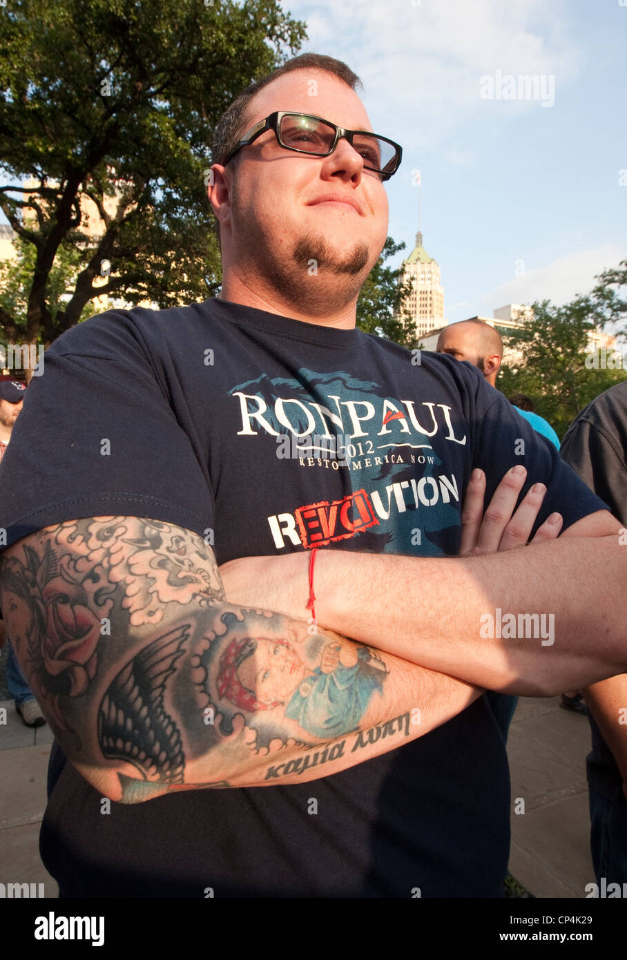 Anglo male with tattoos wears Ron Paul t-shirt at campaign rally in San Antonio, Texas Stock Photo