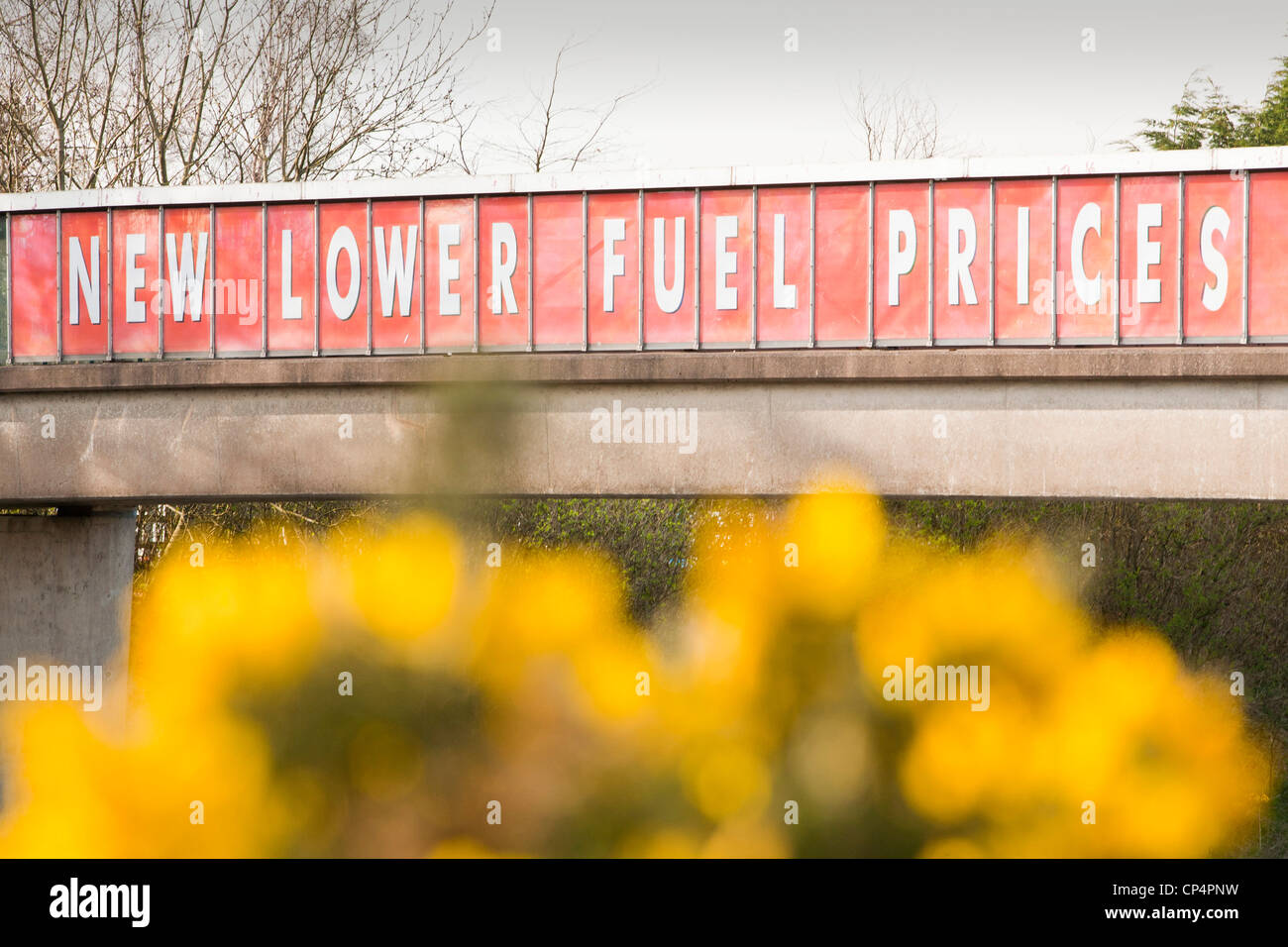 A sign for lower fuel prices at a motorway service station on the M6 motorway near Carlisle, Cumbria, UK. Stock Photo