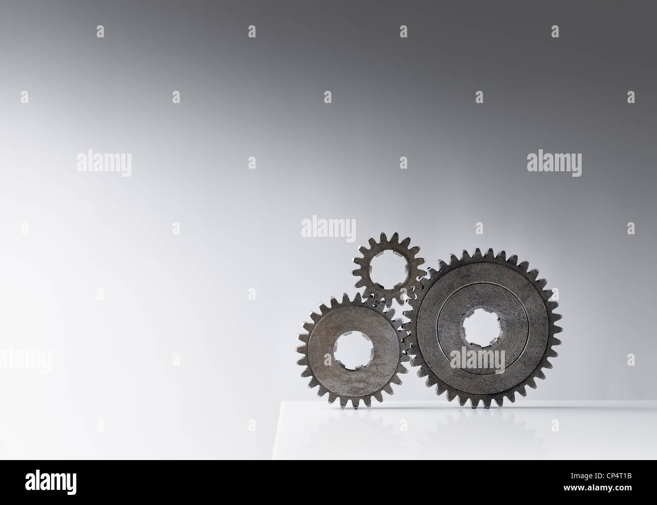 Still life with three old cog gears. Lots of copy space. Stock Photo