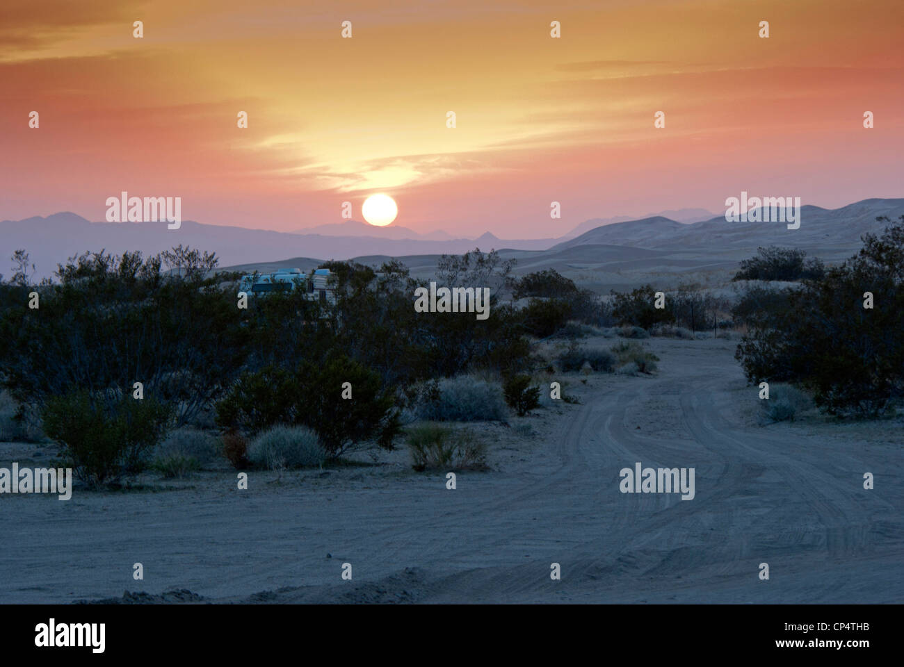 Kelso Dunes, sunset in dunes, camper in bush Stock Photo