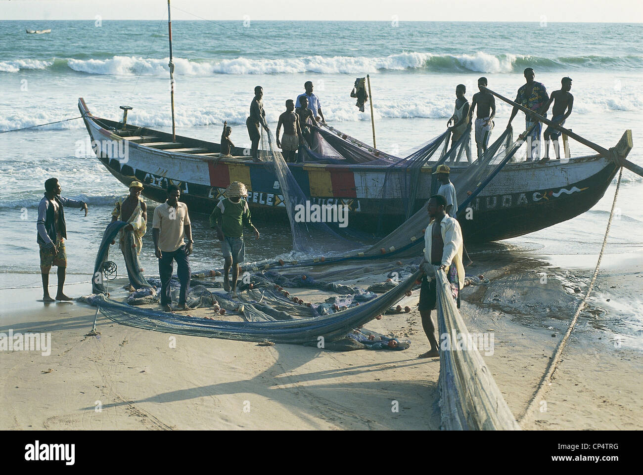 Ghana - Prampram, a fishing vessel on the shore. Stock Photo