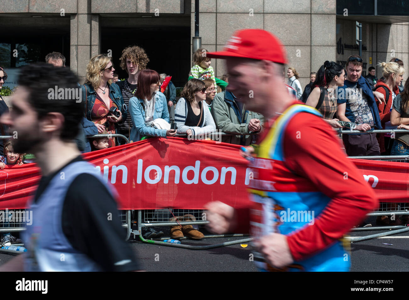 Runners in the 2012 Virgin London Marathon UK. Runners with motion blur in front of London