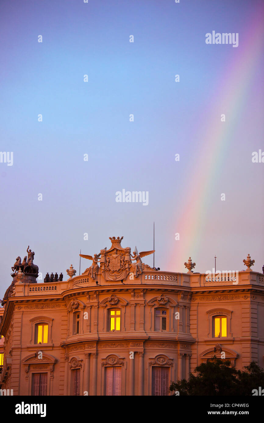 Spain, Madrid, Plaza de Cibeles, view along Calle de Alcala, rainbow at sunset Stock Photo