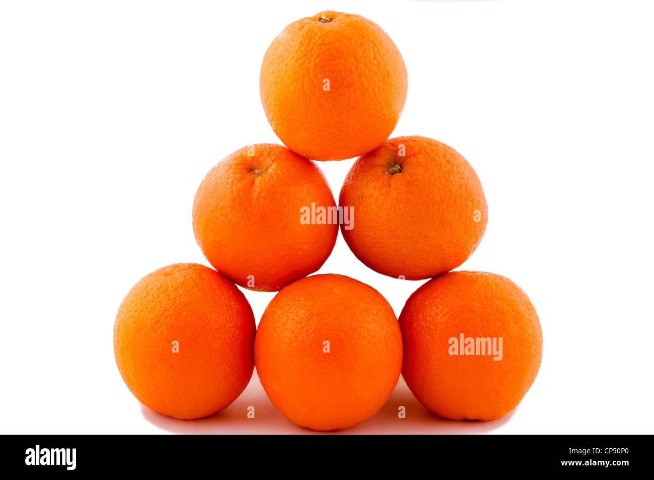 Oranges pyramide isolated on the white Stock Photo
