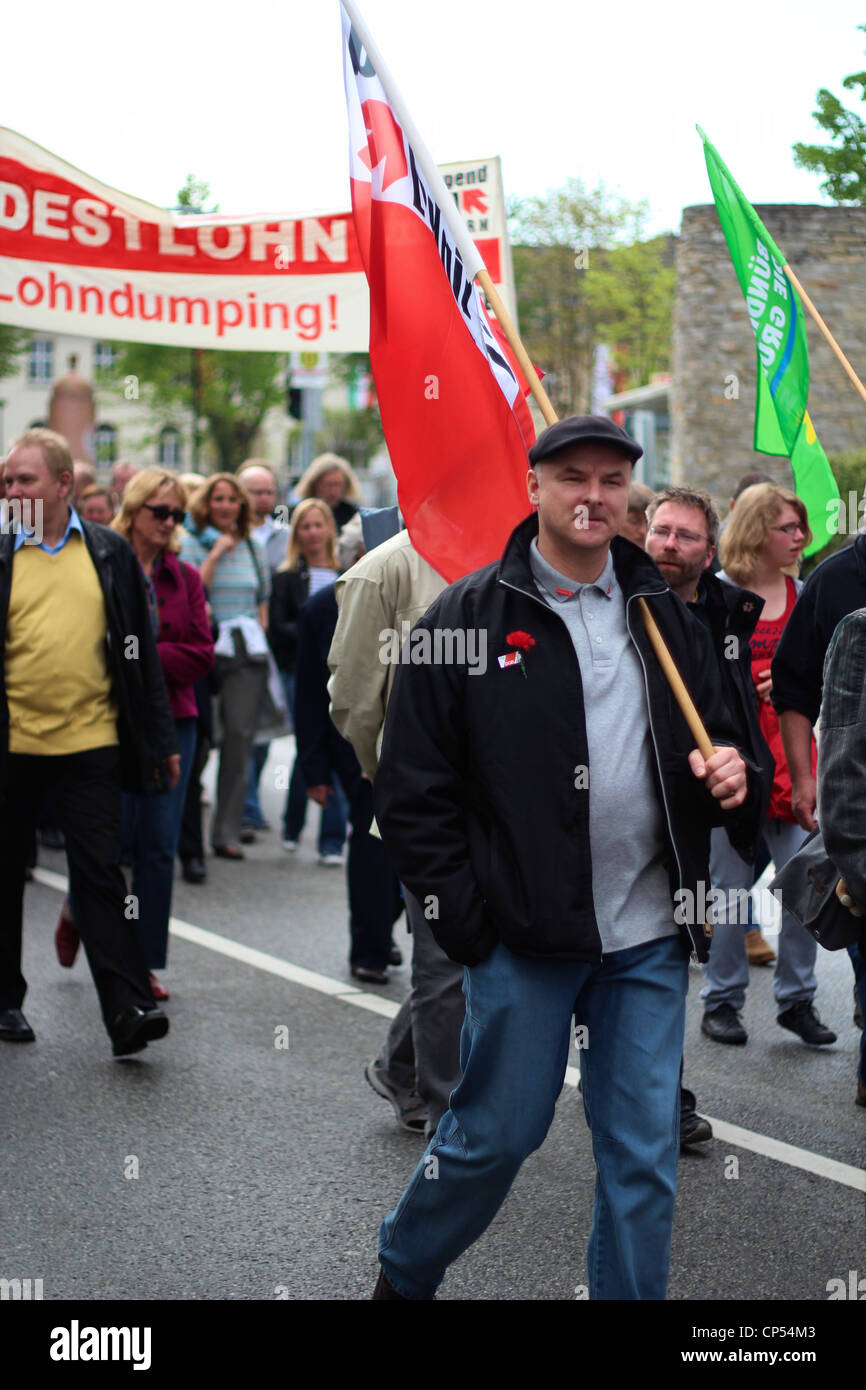 Demonstrator with red IG Metall Flag. Stock Photo