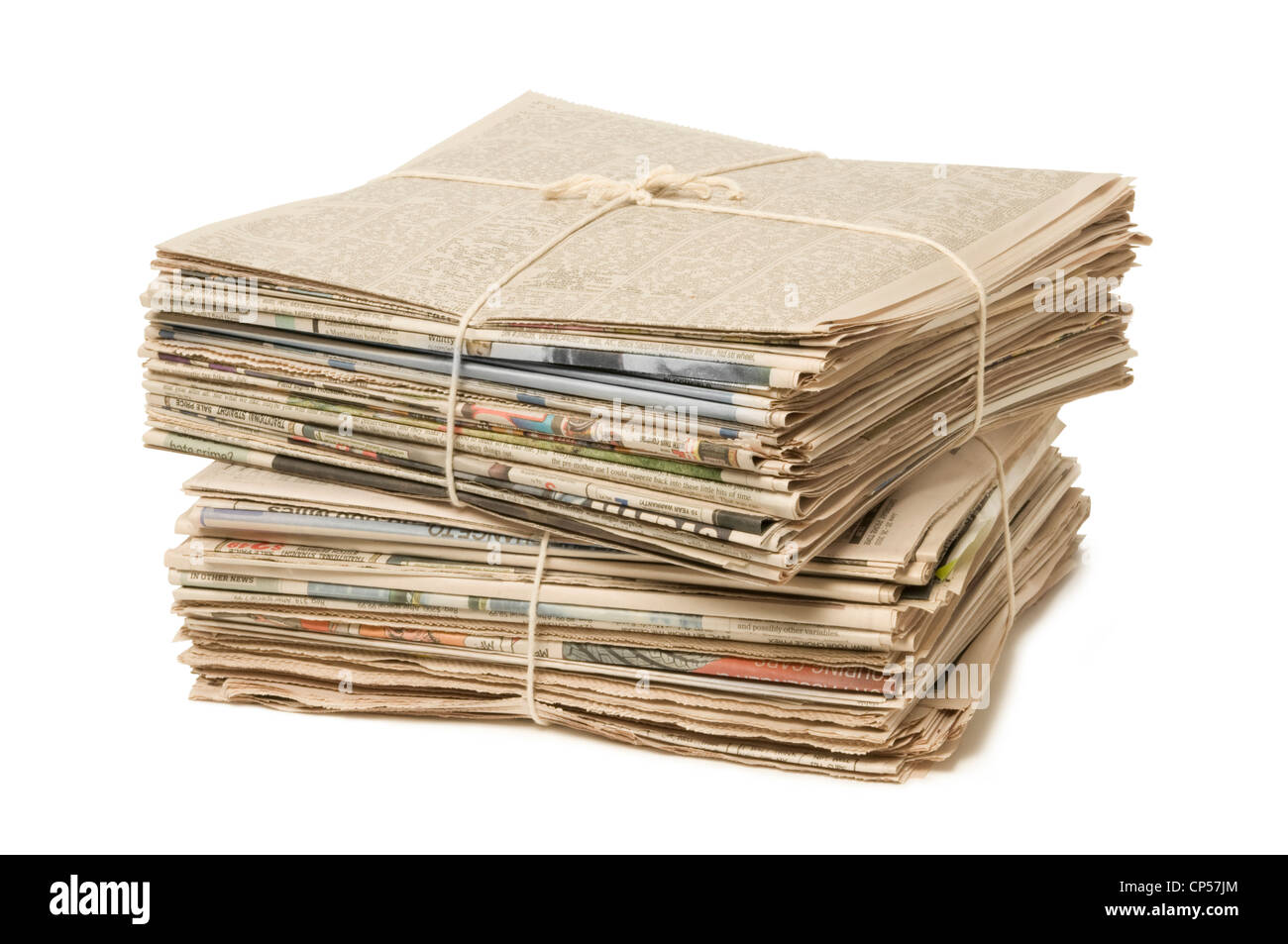 Stack of two newspaper bundles for recycling against white Stock Photo