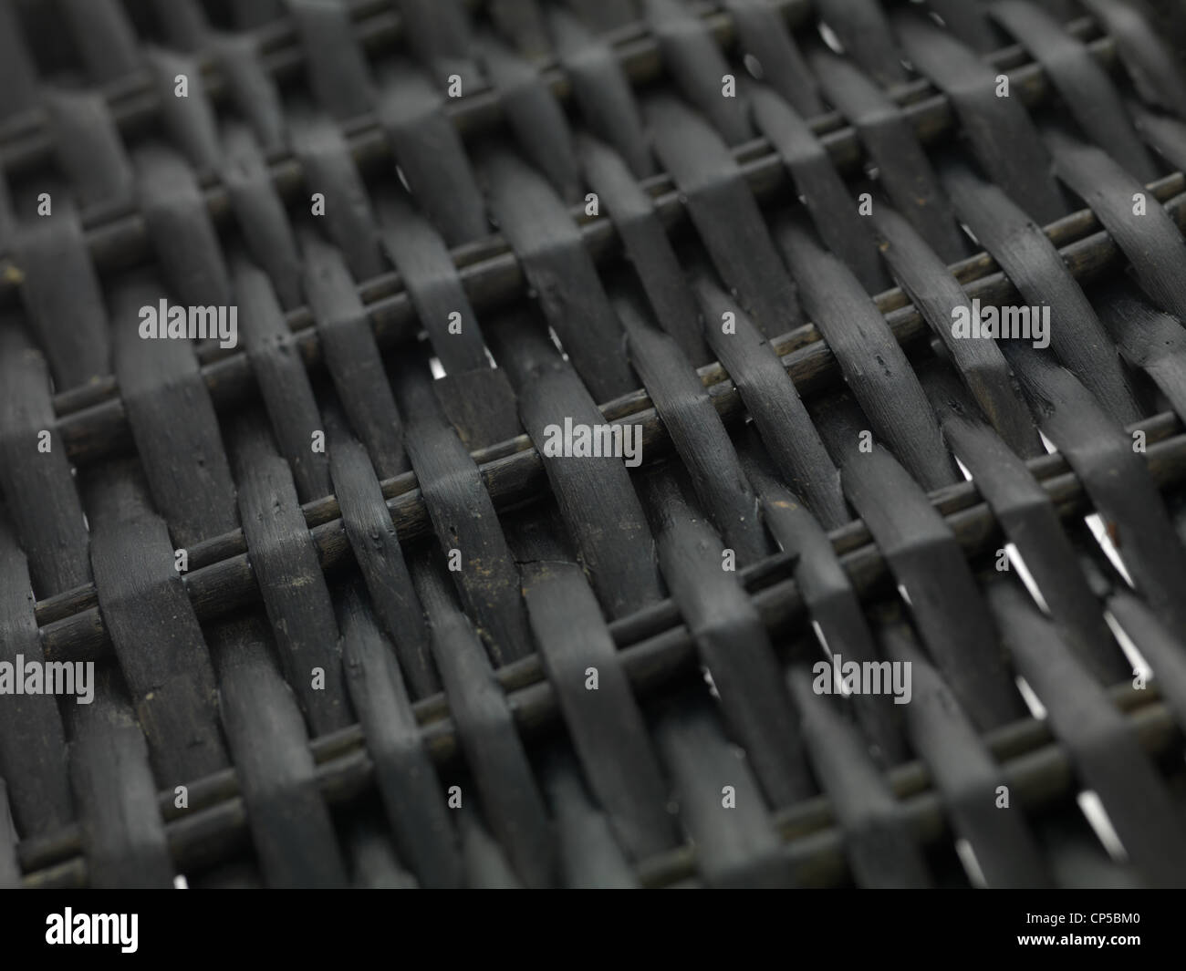 A cane basket isolated against a white background Stock Photo