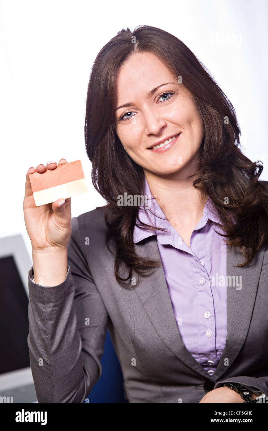 A young woman from bank with a bank card Stock Photo