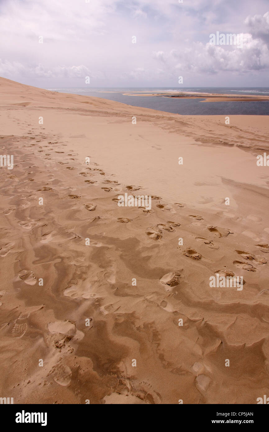 Footprints and windswept sand patterns, Dune du Pyla, Arcachon, France Stock Photo