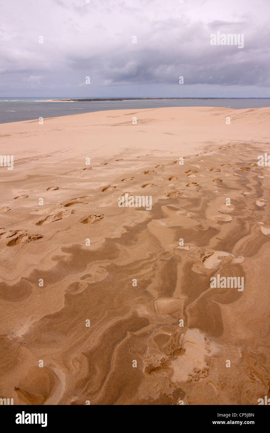 Footprints and windswept sand patterns, Dune du Pyla, Arcachon, France Stock Photo