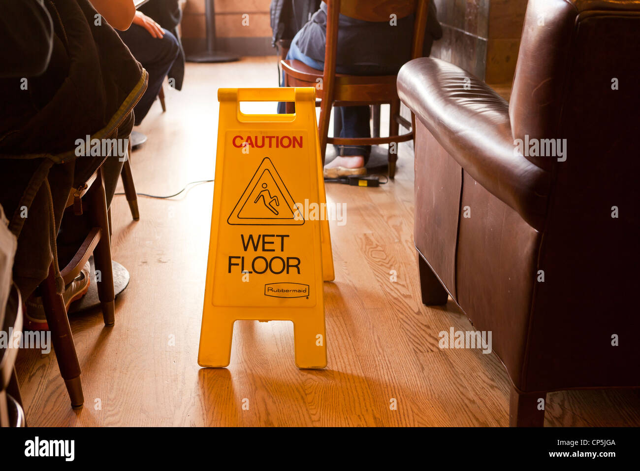 Wet floor safety sign in coffee shop Stock Photo