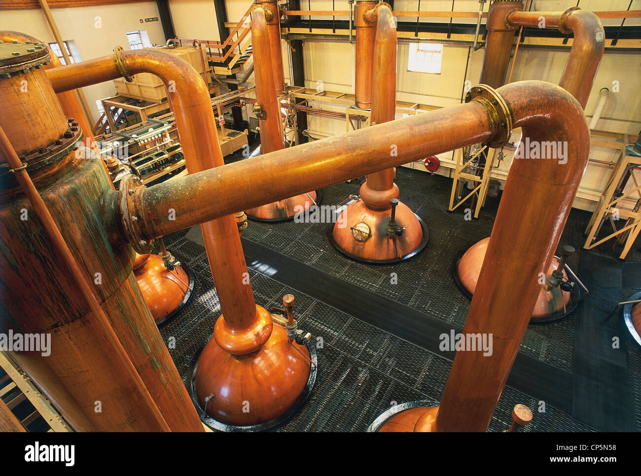 The Glenmorangie distillery branding on the orange wall of the visitor  centre in Tain Stock Photo - Alamy