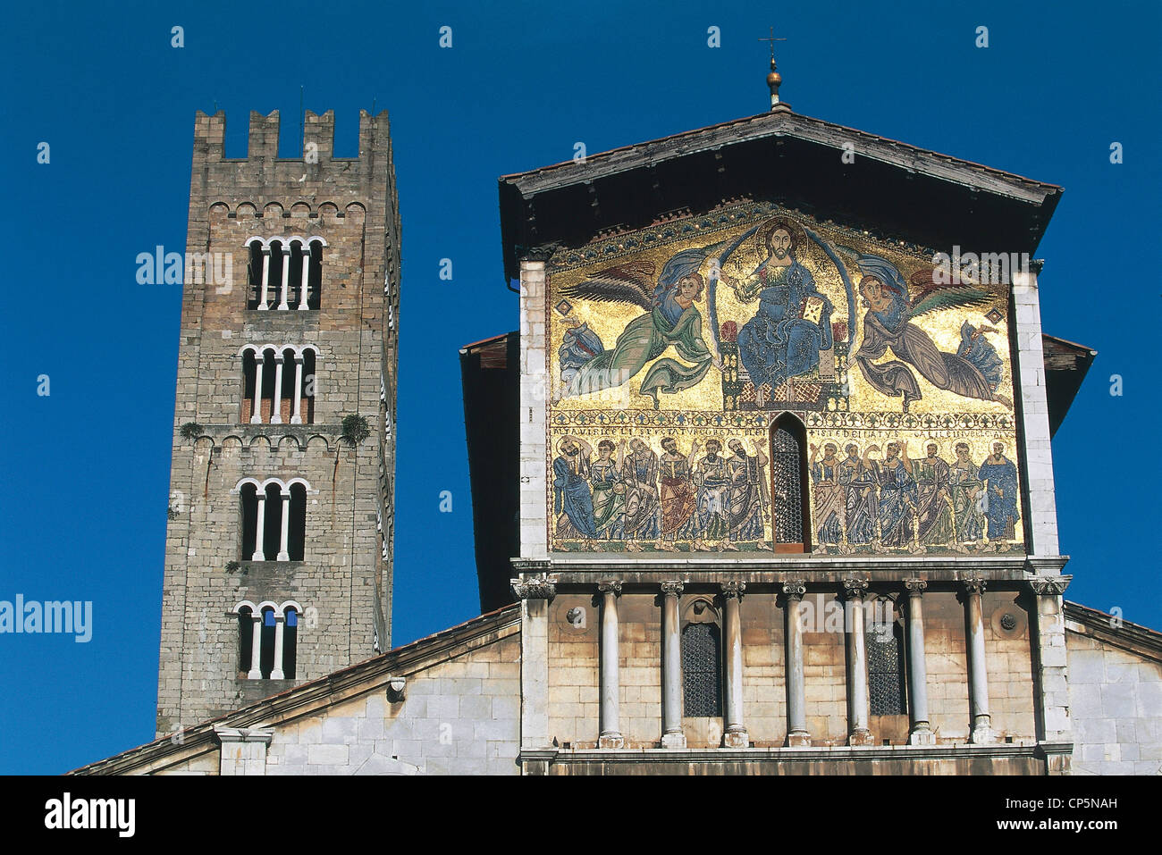 Tuscany Lucca Basilica of San Frediano. Detail of facade with fake balcony mosaic depicting Ascension of Christ. In background Stock Photo
