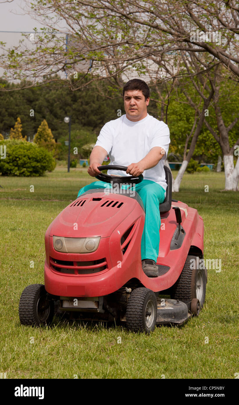 Rideon lawn mower cutting grass Stock Photo Alamy
