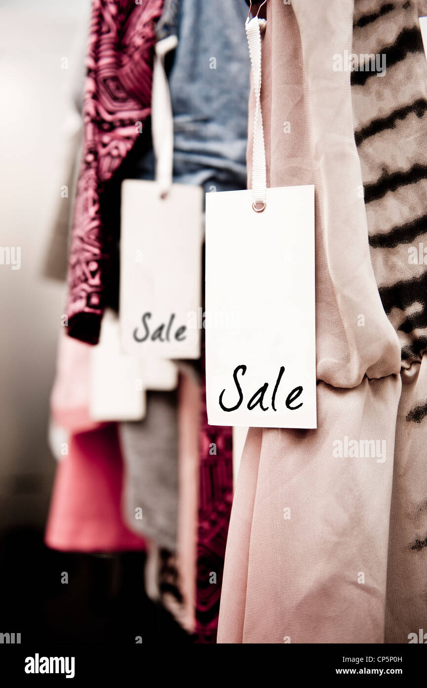 Sale tag on a rack of clothing in a 