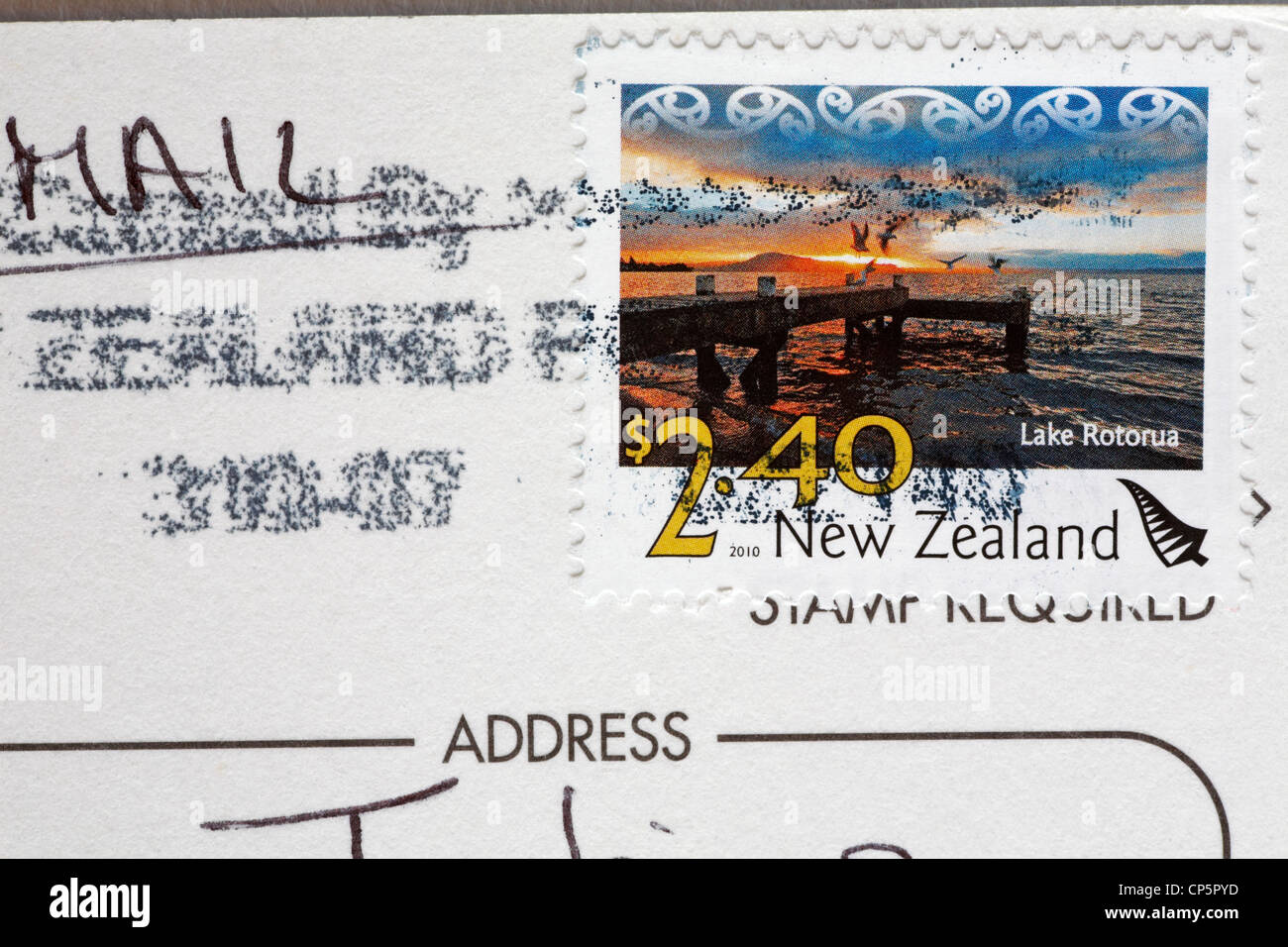 postcard from New Zealand showing New Zealand stamp with picture of Lake Rotorua for $2.40 Stock Photo