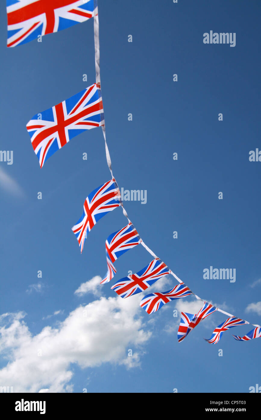 Jubilee United kingdom flags blowing in wind with blue sky Stock Photo