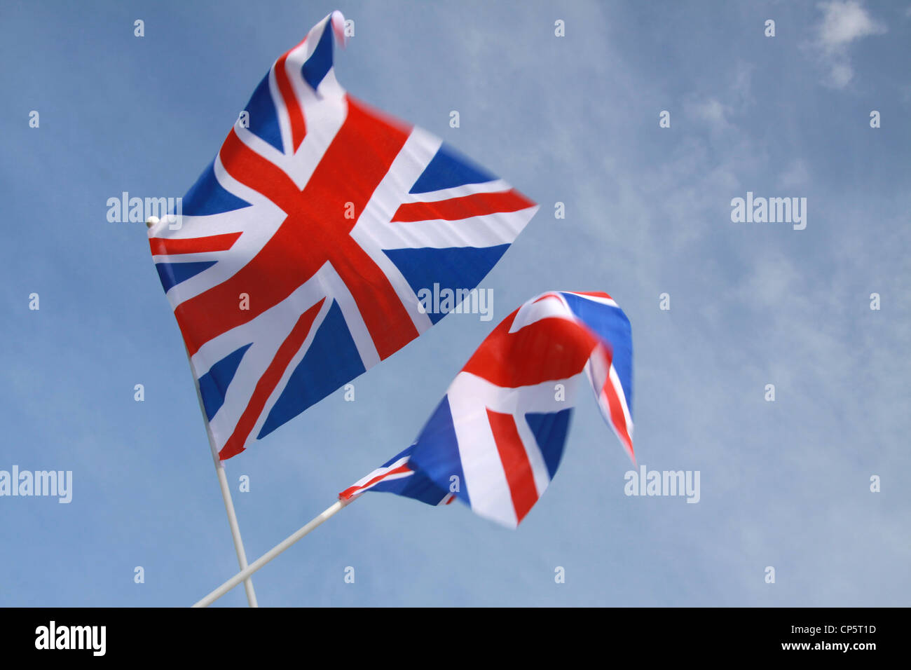 Jubilee United kingdom flags blowing in wind with blue sky in landscape horizontal format Stock Photo