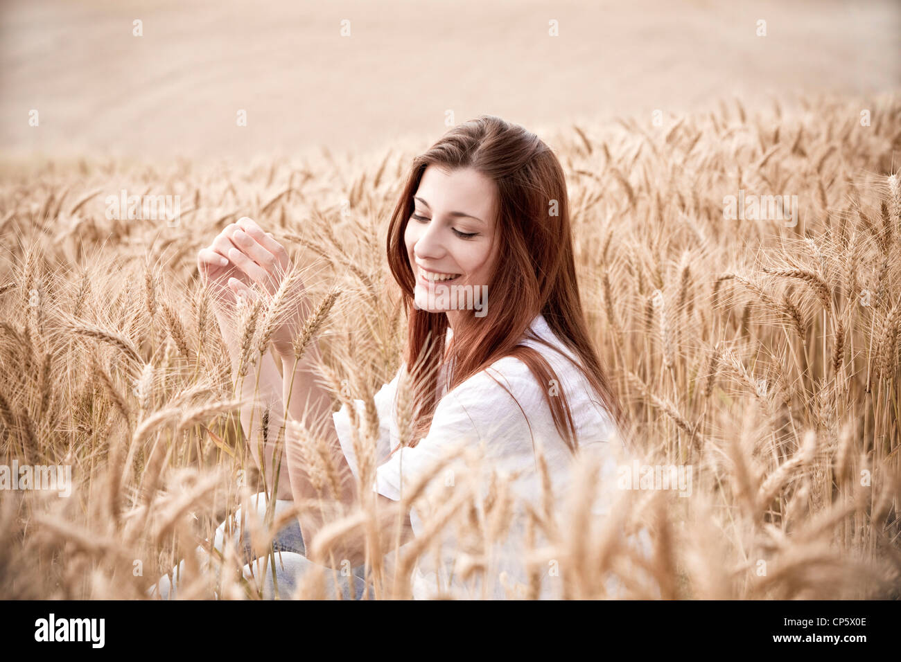 woman in a field of wheat Stock Photo - Alamy