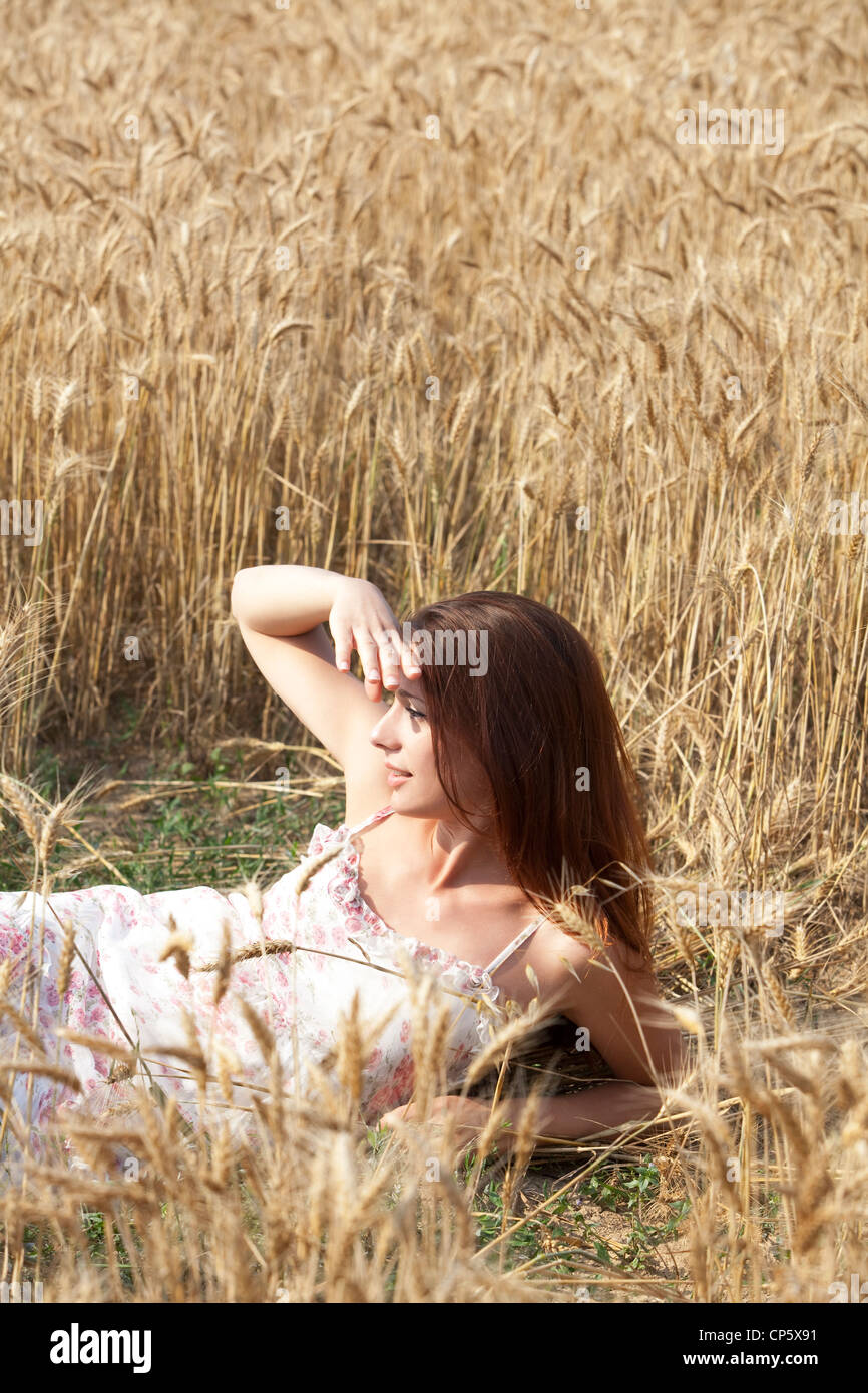 woman lying in a field of wheat Stock Photo - Alamy