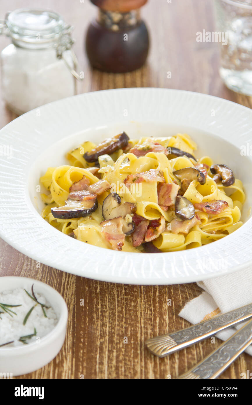 Fettuccine Carbonara with bacon and mushroom Stock Photo